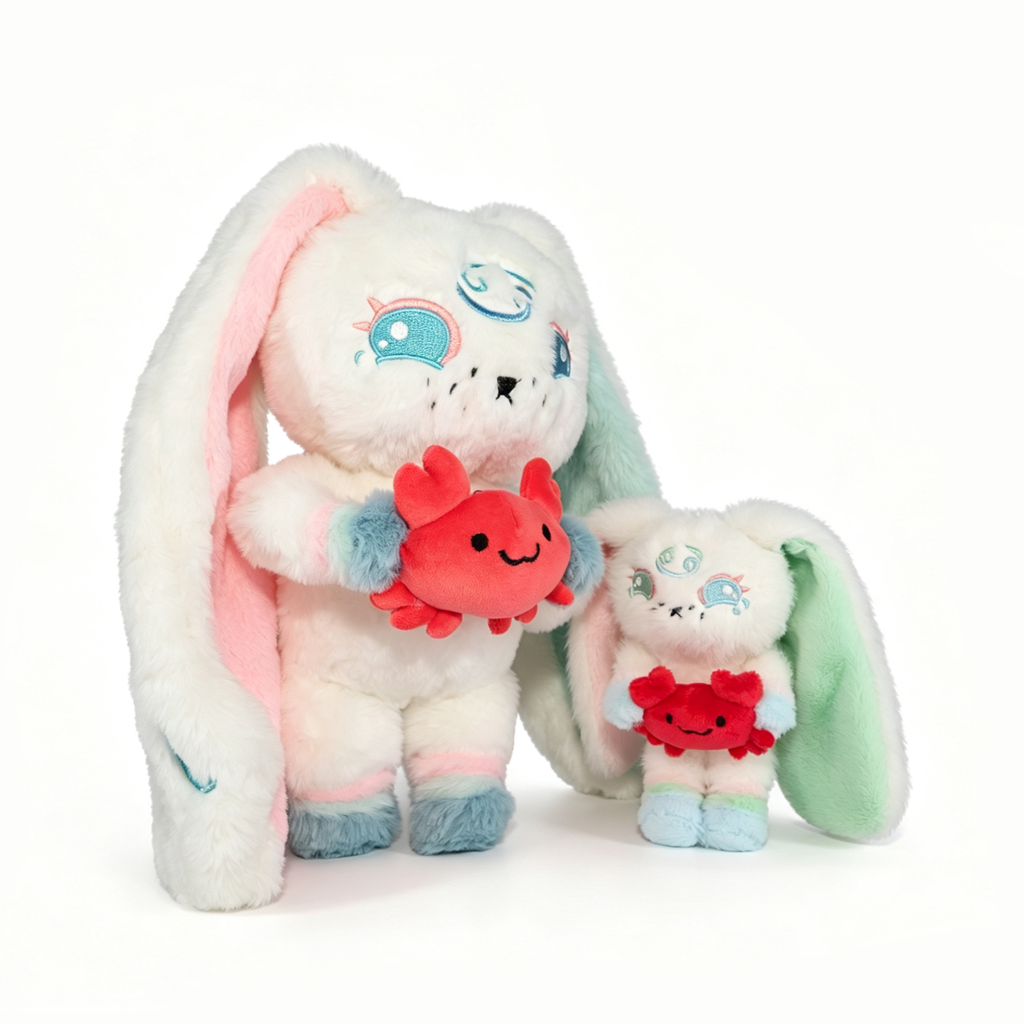 Two pastel bunny plush toys with long ears hold red Cancer Plush Keychains, one bunny is larger than the other.