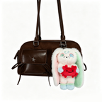 Brown handbag with a star detail and a Cancer Plush Keychain plushie attached, perfect as a Cancer Zodiac Gift.