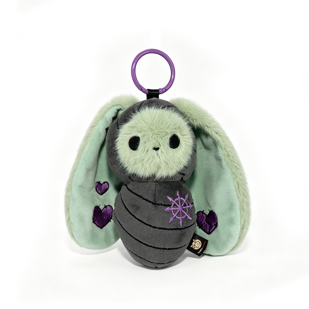 Plushie Dreadfuls Bunnculus Plush Keychain: mint green rabbit plush with purple hearts and a purple ring on top.