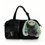 Black leather handbag with a Plushie Dreadfuls bat keychain featuring mint green wings and purple heart accents.