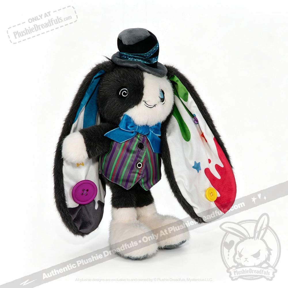 Plushie black and white bunny channels ADHD Mad Hatter vibes with a quirky hat, bow tie, and mismatched fabric ears.