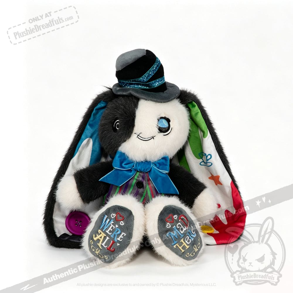 Plushie rabbit in a suit, blue bow tie, top hat, colorful ears—ADHD Mad Hatter vibe with Were All Mad Here on paws.