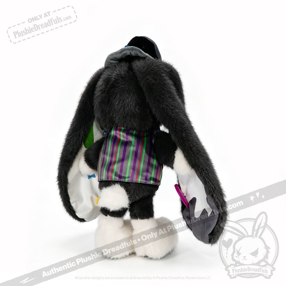 Plush black bunny plushie with long ears and a purple-striped vest, shown from the back on a white background.