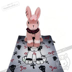 Limited edition plushie: Pink bunny on a mat with scissor designs, from plushiedreadfuls.com.